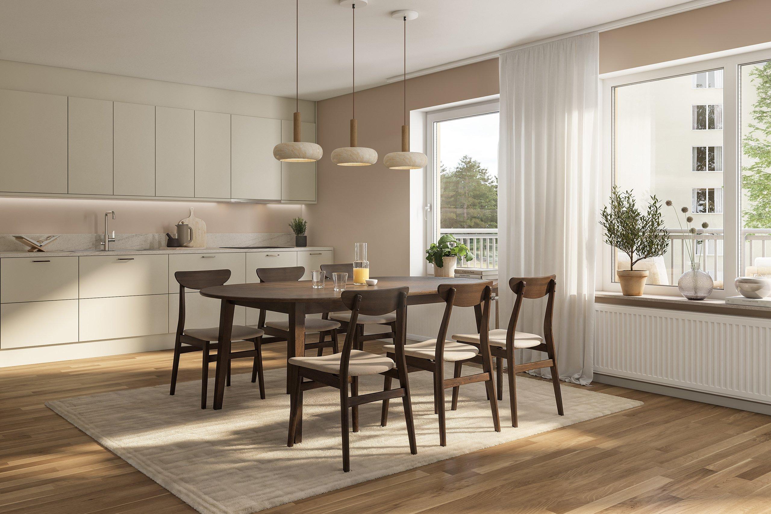 Köket är välplanerat med tidlösa materialval med bänkskiva i grå laminat som fortsätter upp på väggen i form av en bakkantslist och släta luckor. Vitvarorna är helintegrerade för ett stilrent uttryck (visionsbild).