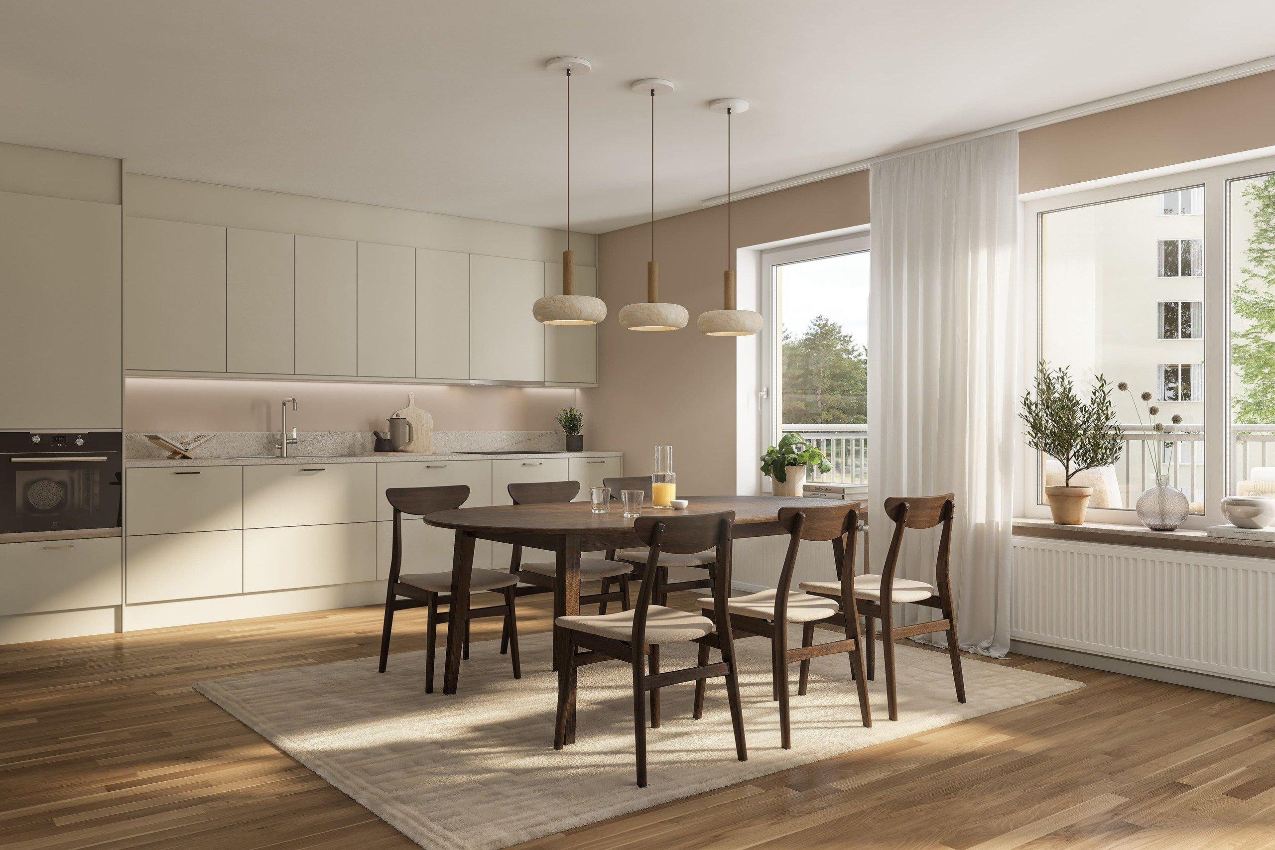 Köket är välplanerat med tidlösa materialval med bänkskiva i grå laminat som fortsätter upp på väggen i form av en bakkantslist och släta luckor. Vitvarorna är helintegrerade för ett stilrent uttryck (visionsbild).