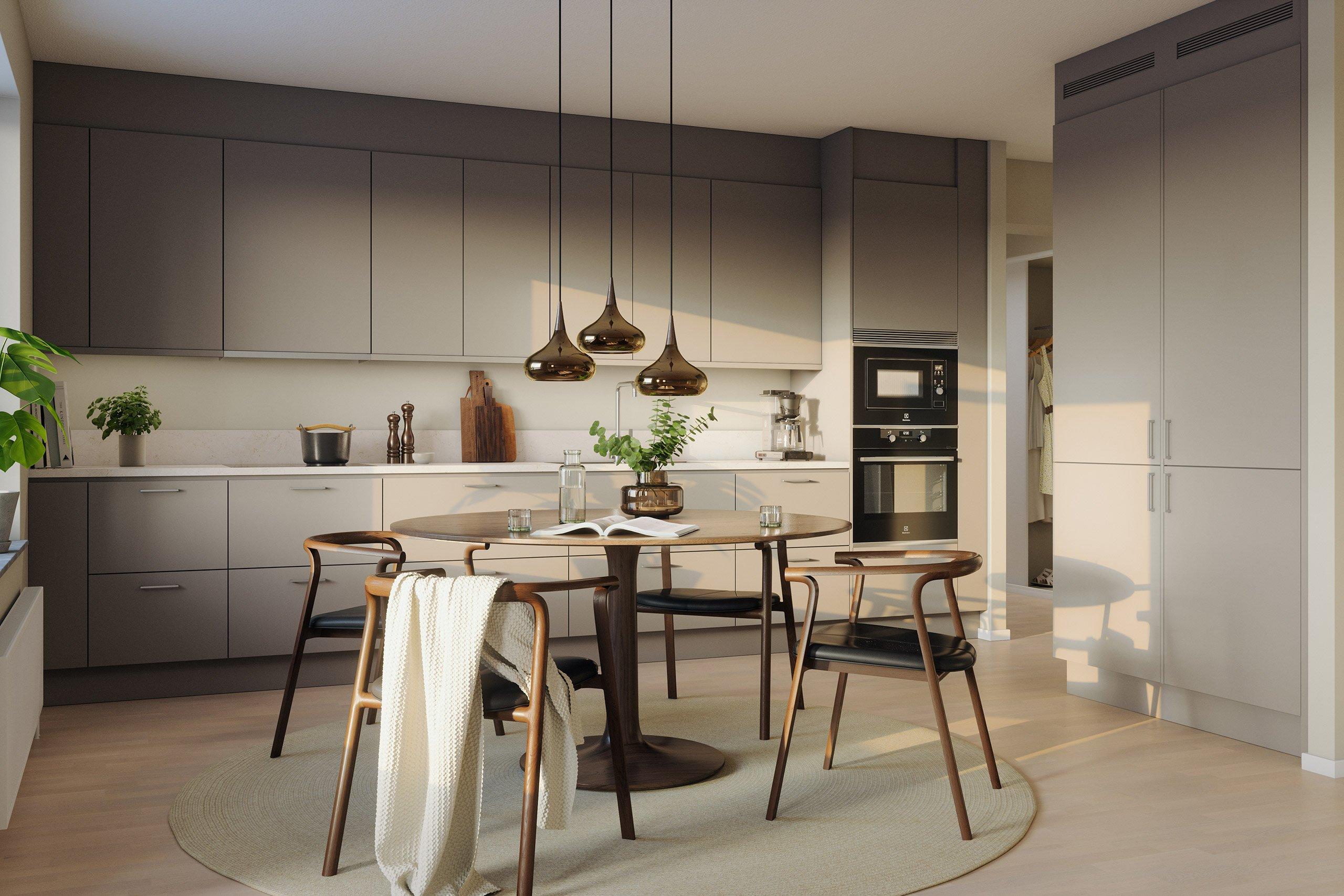 Köket inreds med släta luckor och bänkskiva samt bakkantslist i kompositsten. Köket är fullt utrustat med moderna vitvaror, noga utvalda ur såväl kvalitets- som energiperspektiv (visionsbild).