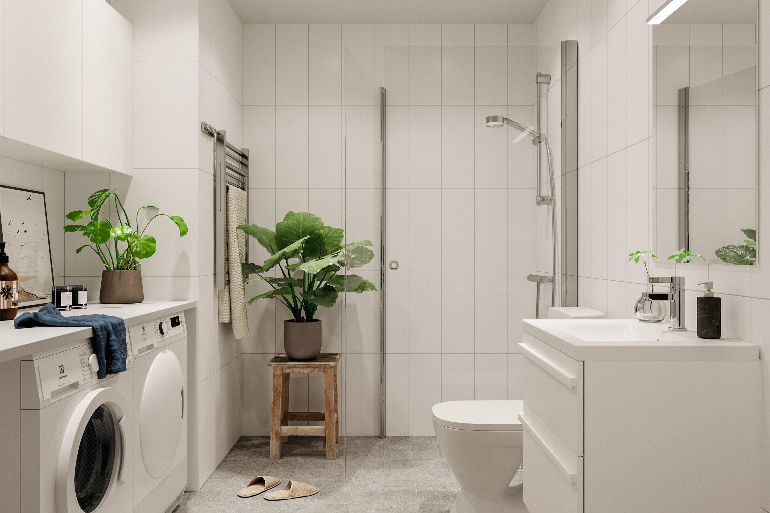 Badrummen får väggar i ett vitt stående kakel och ett ljust grått klinker på golven. De utrustas också med tvättmaskin och torktumlare (visionsbild).