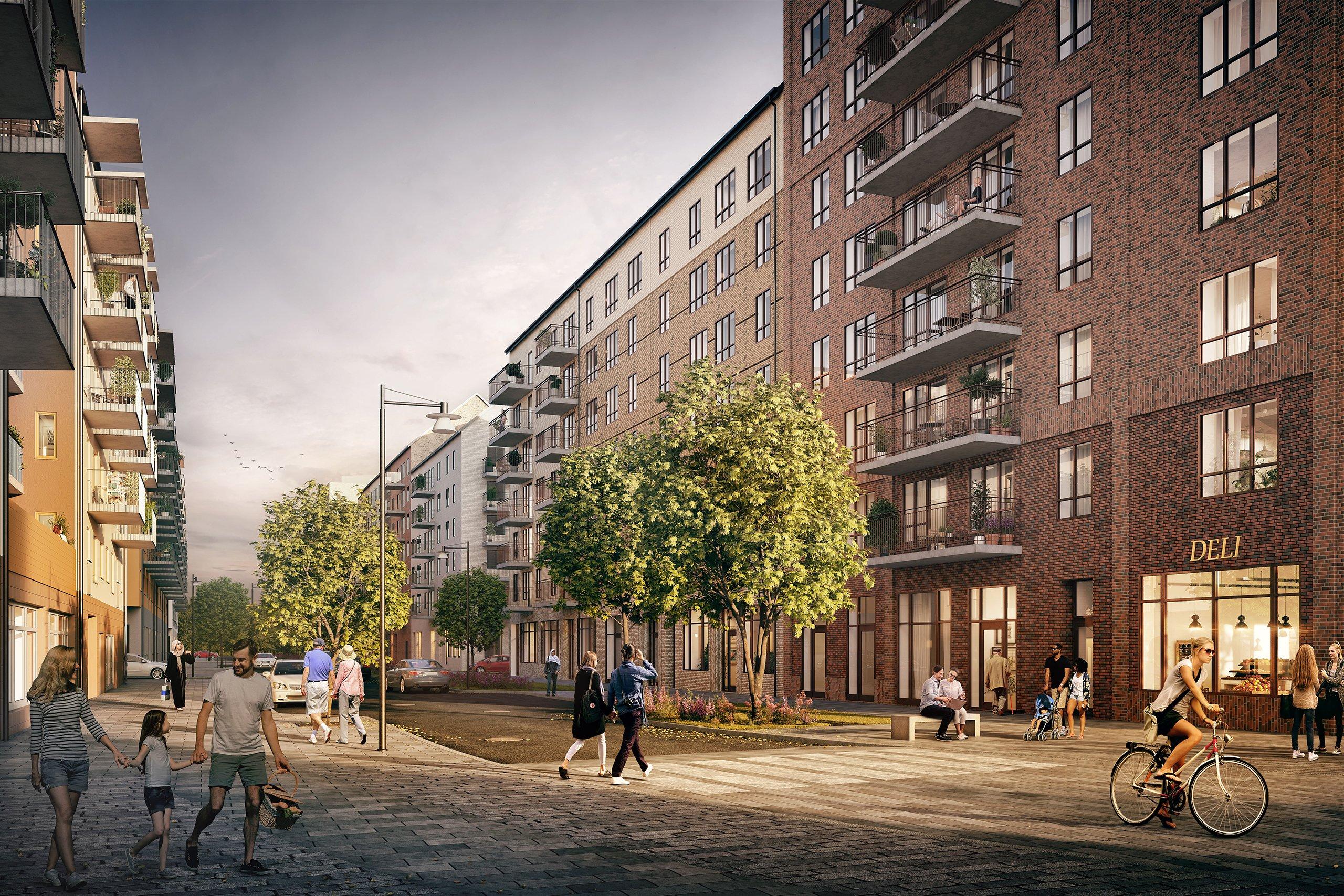 Stadsmässig gata med liv och rörelse, samt det kommande kvarteret Fabriken.