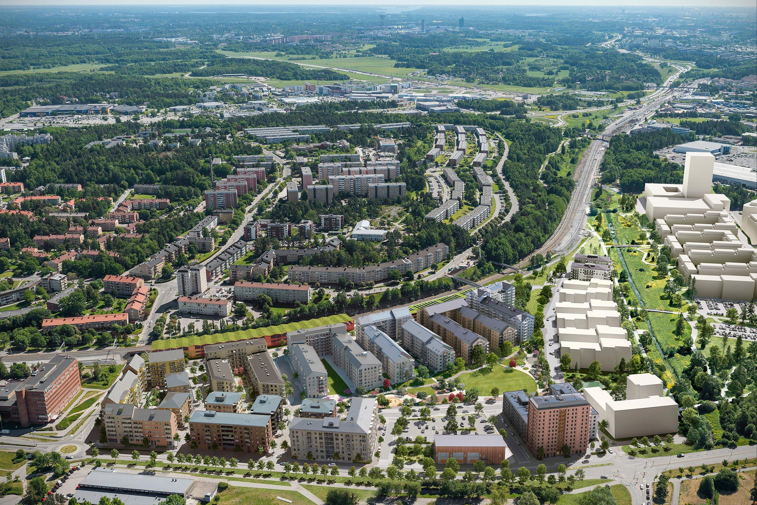 Nytt bostadsområde vid pendeln, omgivet av stora grönområden.