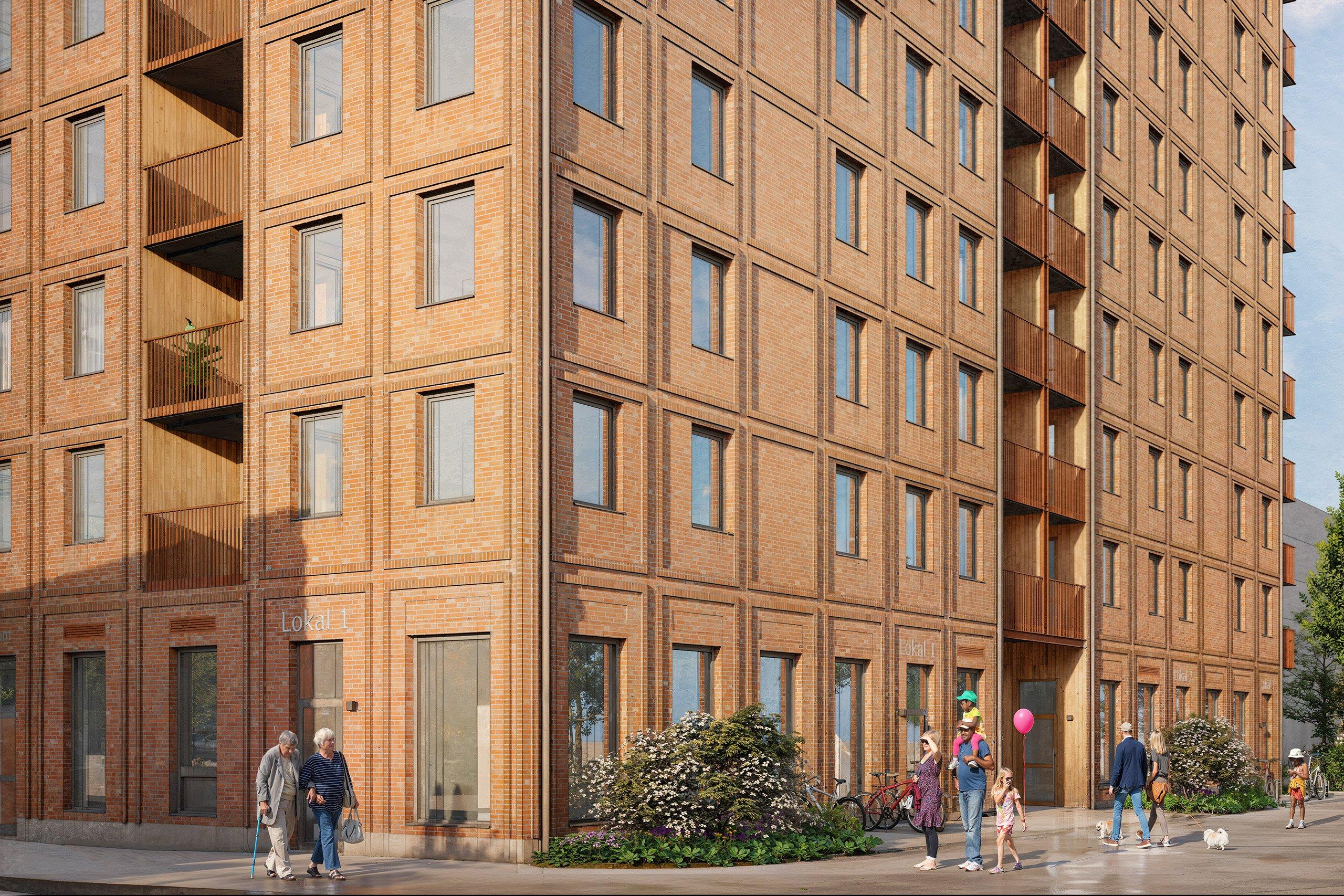 Modernt bostadskvarter med kommersiella lokaler i entréplan.