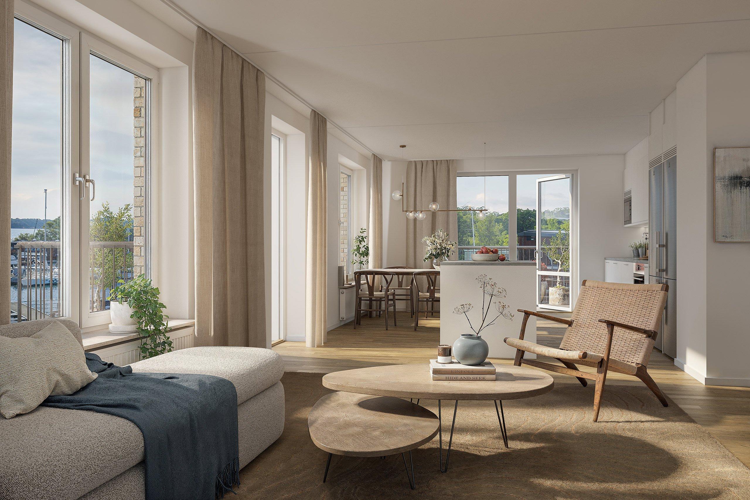 Ljust vardagsrum med havsutsikt.