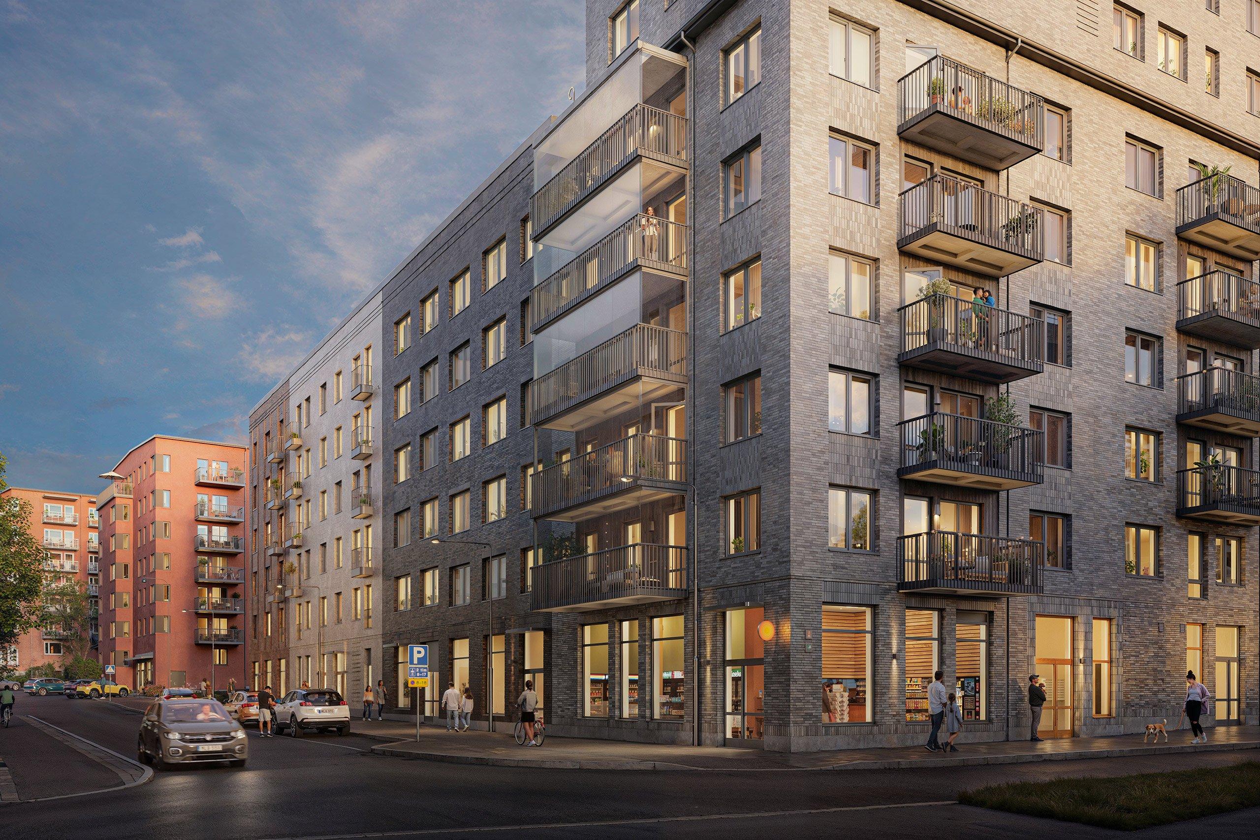 Modernt bostadskvarter med upplyst lokal i nedre plan.