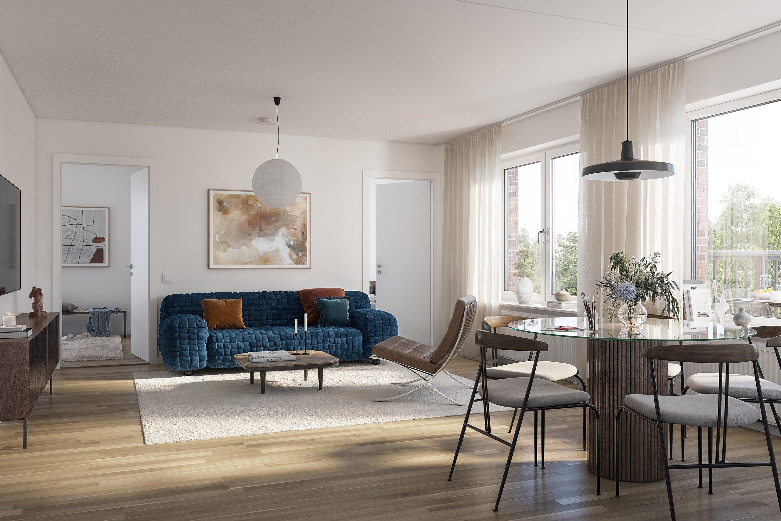 Ljust vardagsrum med sittgrupp och parkettgolv.