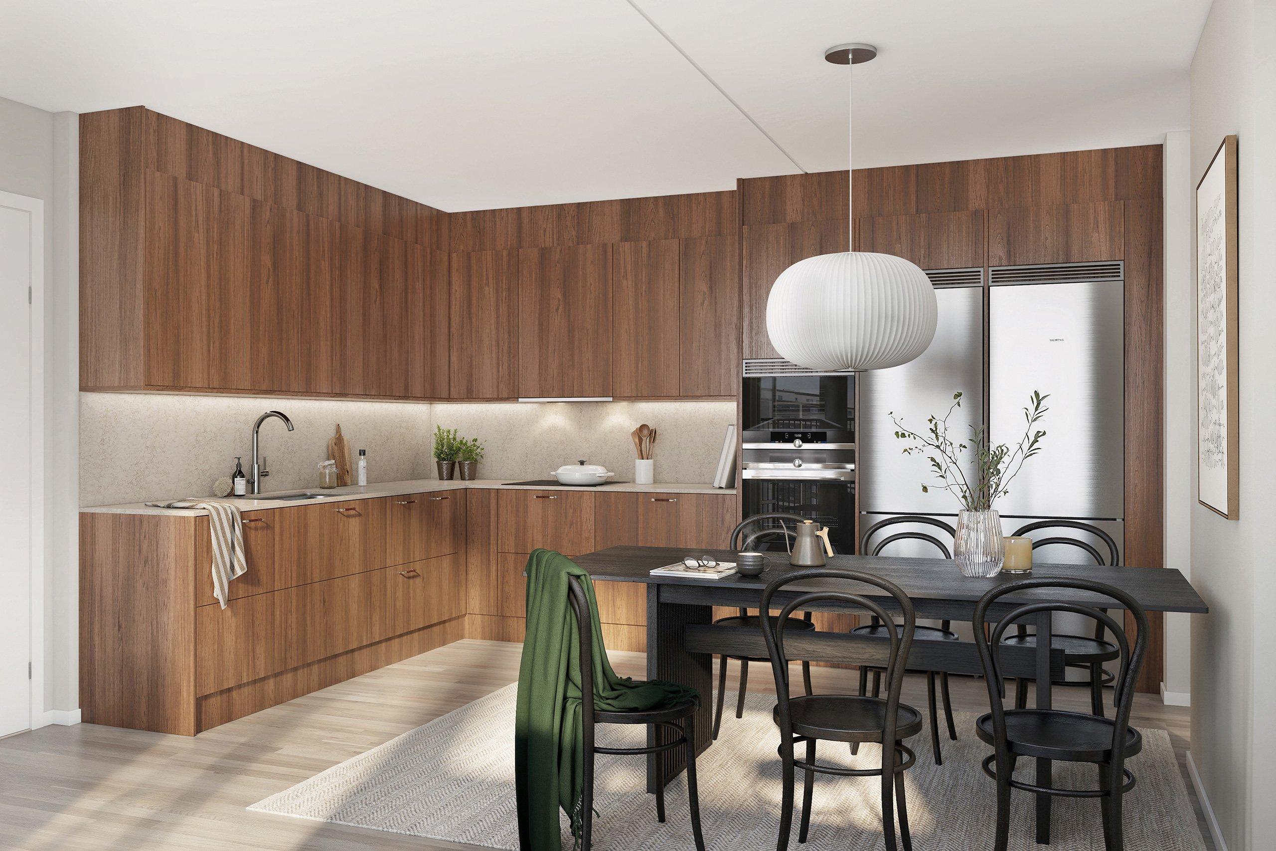 Visionsbild av kök med köksluckor i valnöt, högskåp med ugn och mikro samt rostfri kyl och frys.