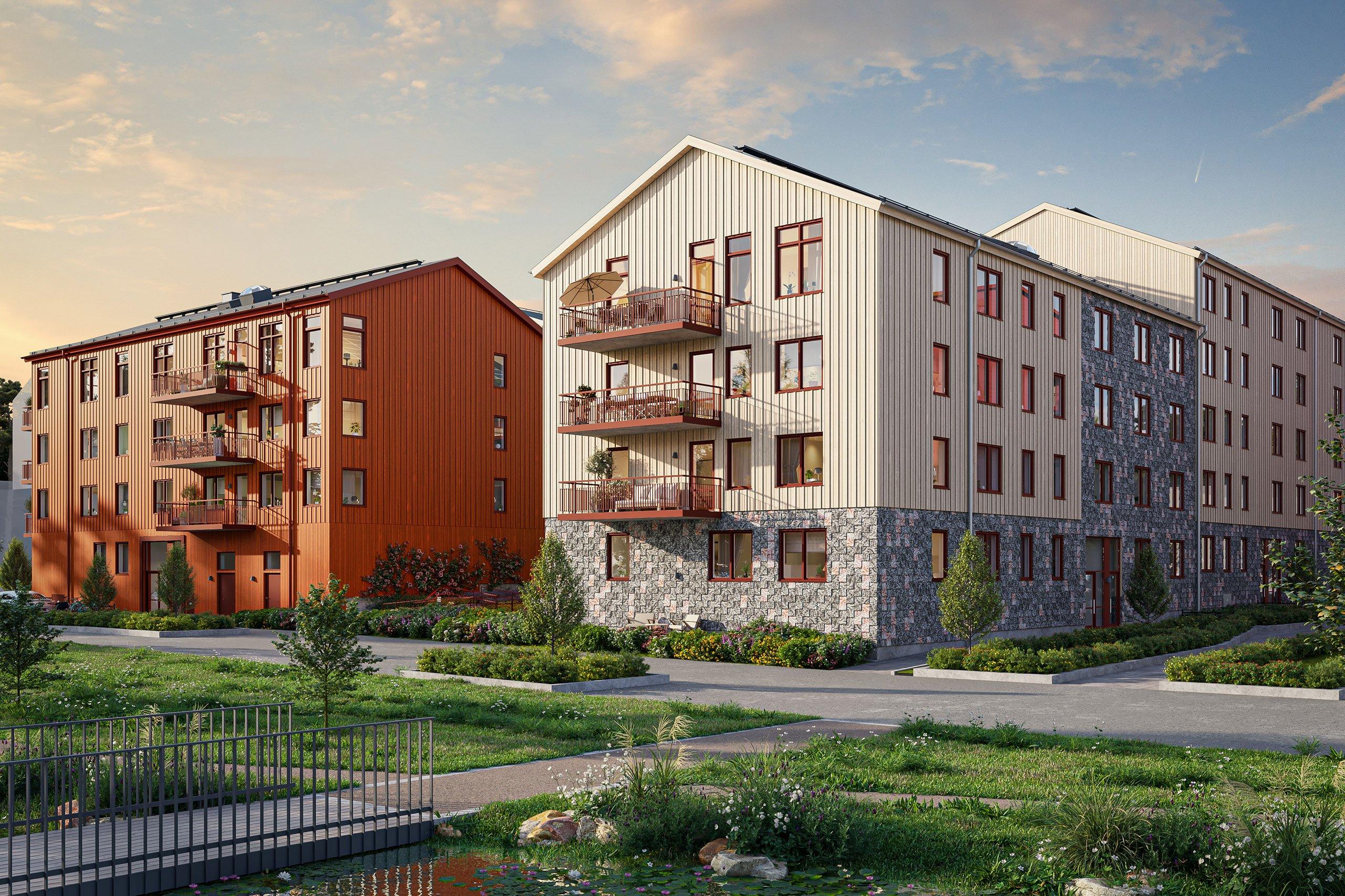 Bonicas flerbostadshus i beigevit och röda färger med dagvattenstråket precis utanför porten.