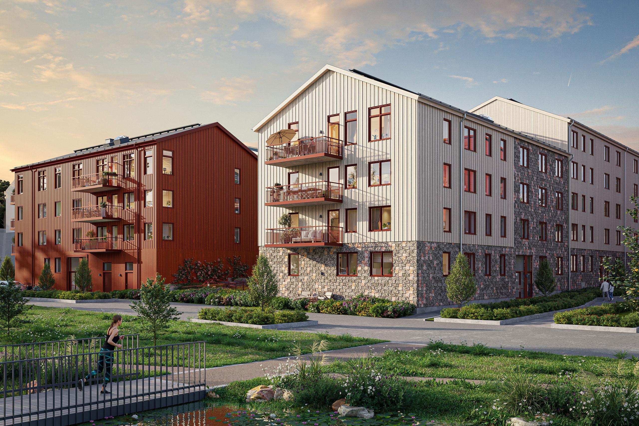 Bonicas vita och röda fasader vid dagvattenstråket, en kvinna joggar över bron.