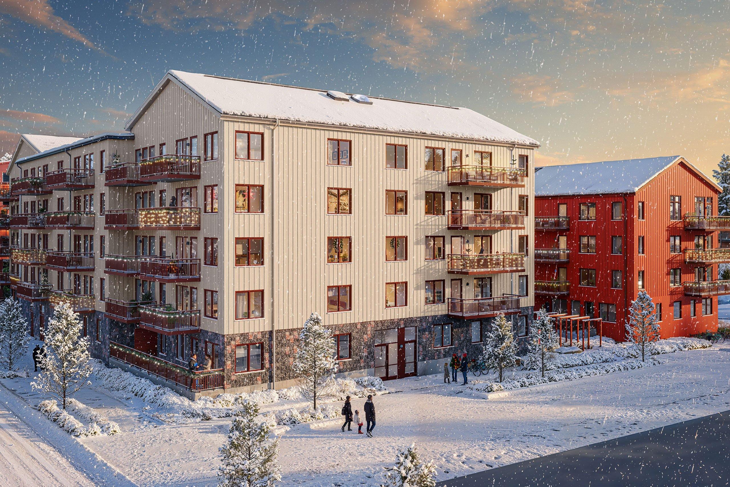 Bonicas två hus i vinterskrud i dagsljus det snöar lätt, snötäckta gator och ljusslingor på balkongerna.