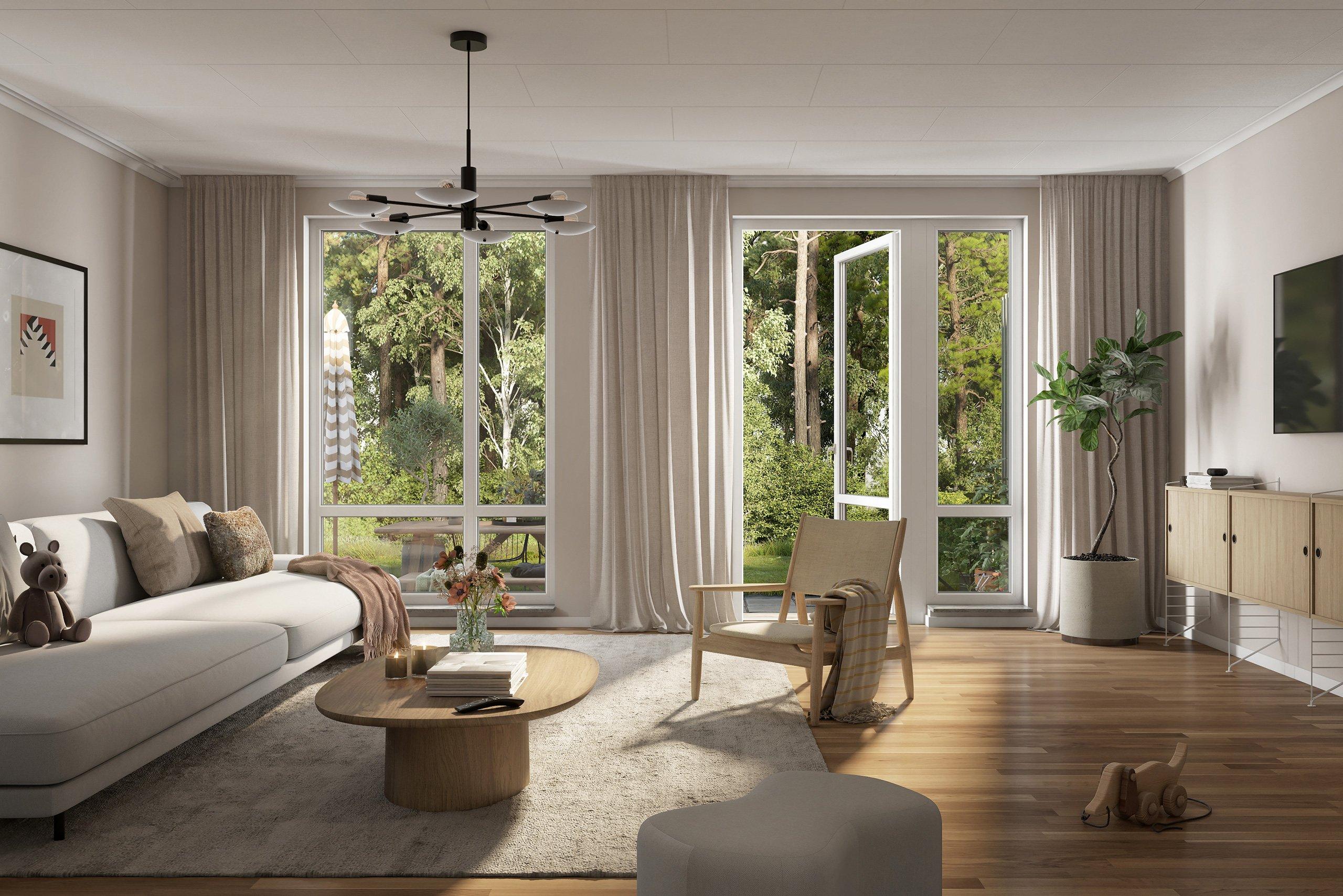 Ljus vardagsrum i parhuset med vardagsrumsmöbler och en uteplats som vetter mot skogen intill.