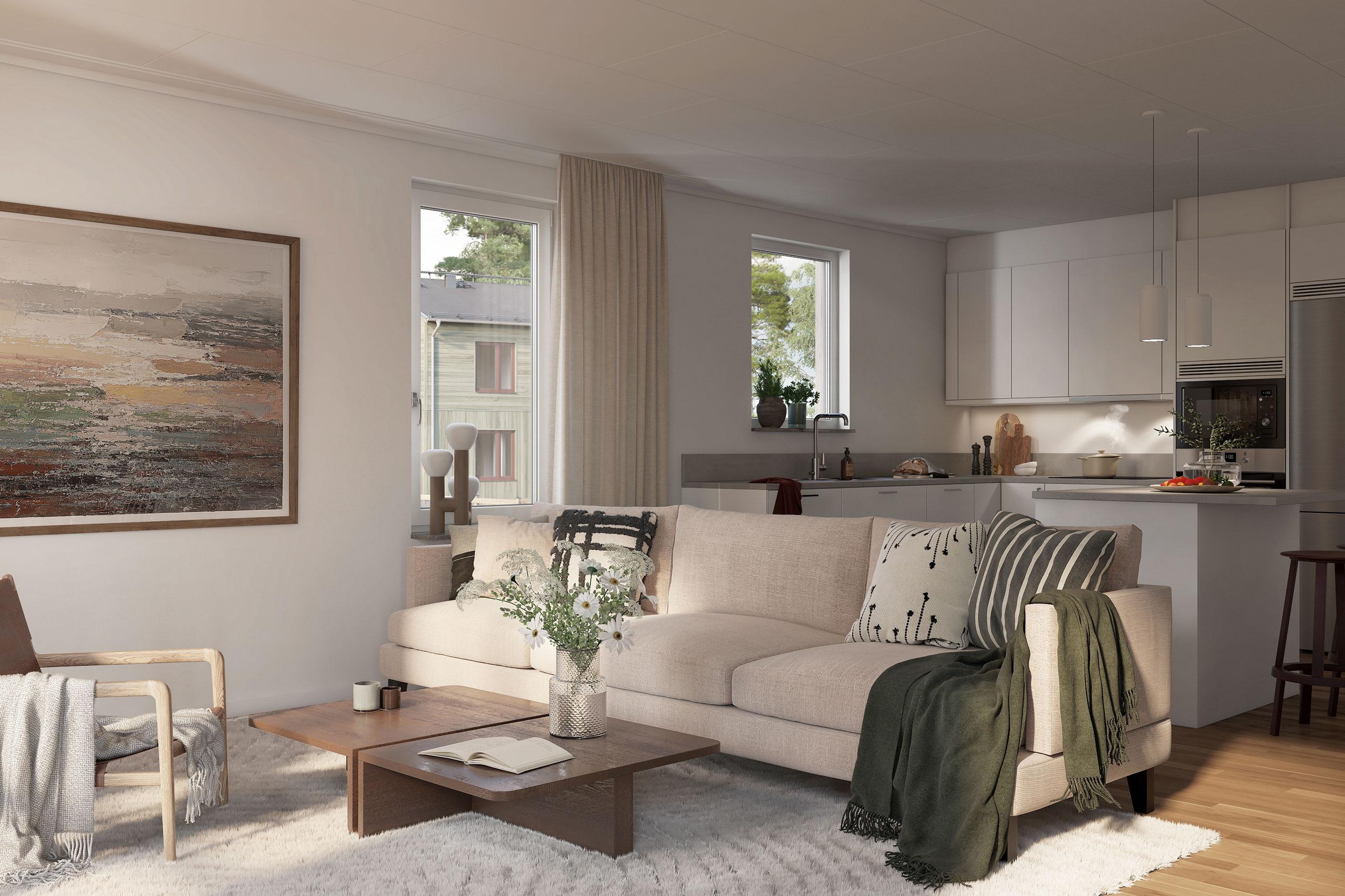 Öppen planlösning mellan kök och vardagsrum i villan. Kök med köksö och rostfria vitvaror.