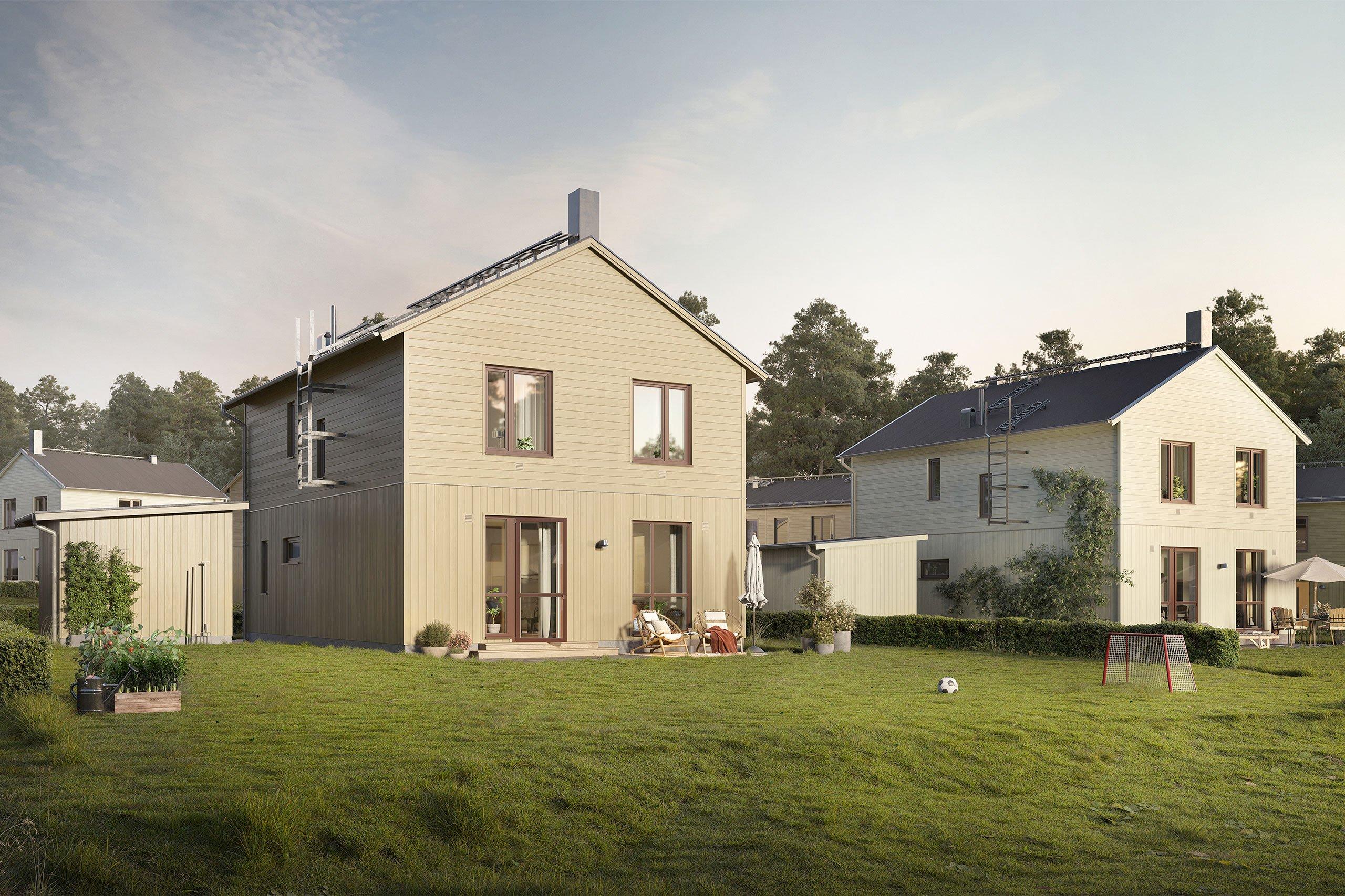 Villor i ljus träpanel med uteplats och utemöbler framför en grön gräsyta.