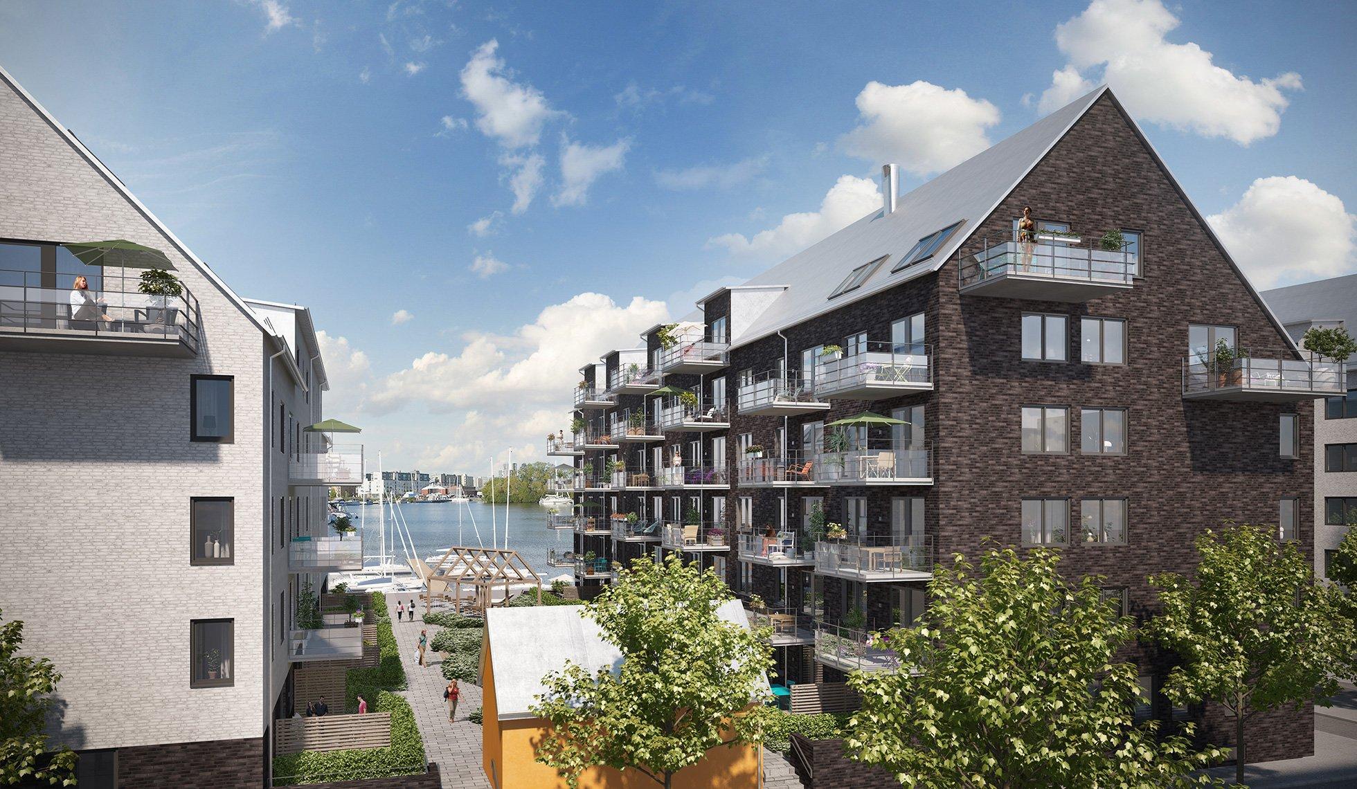 Fasaden utgörs av sobert tegel och puts och byggnadernas arkitektur får ett elegant uttryck med marint tema.