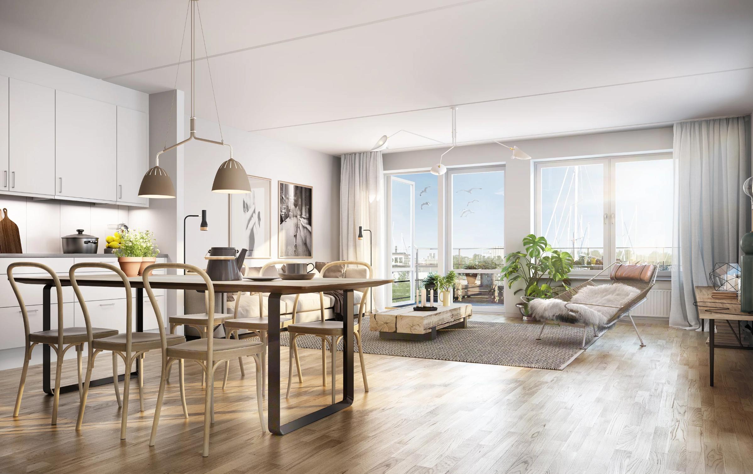 Ljus lägenhet med öppen planlösning och balkong.