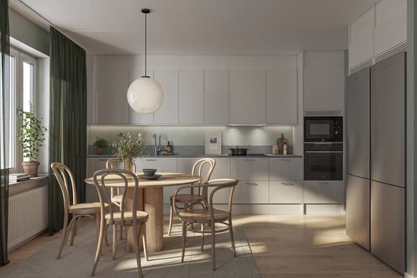 Som original har köket vita luckor med klicköppning och lådor med rostfria beslag. Här finns väl tilltagen arbetsyta och energieffektiva vitvaror i rostfritt (visionsbild).