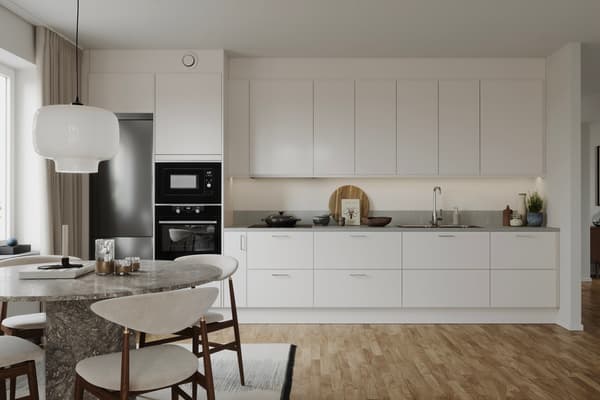 I vår originalinredning ingår vackra vita kök med rostfria vitvaror som är noga utvalda (visionsbild).