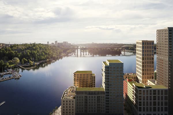 Husfasader med Årstaviken i bakgrunden. 