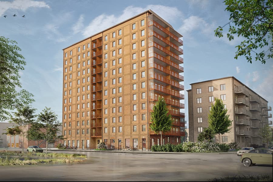 Modernt tolvvåningshus med tegelfasad.