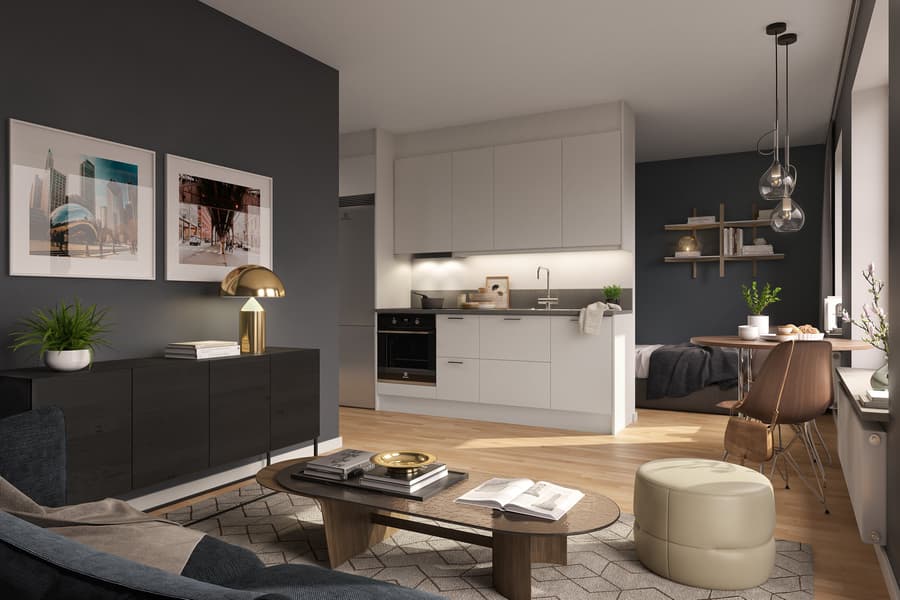 Modernt vardagsrum i bruna toner mot kök i vitt, bakom köket en sovalkov.