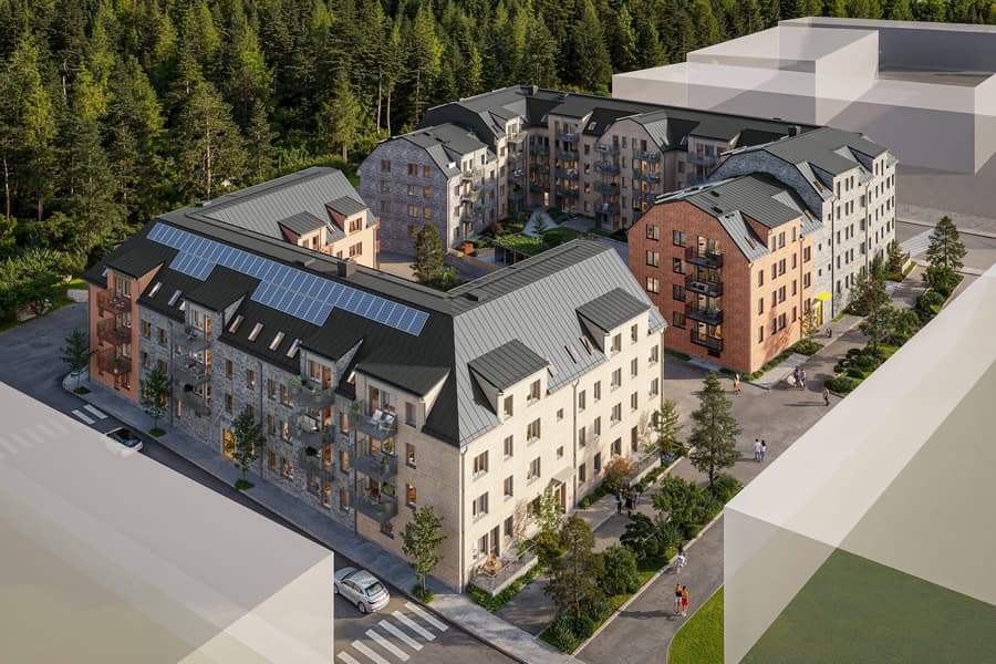 Modernt bostadskvarter vid lummig granskog.