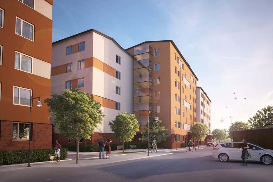 Moderna bostadskvarter i vitt och orange, gatan framför kantas av träd.