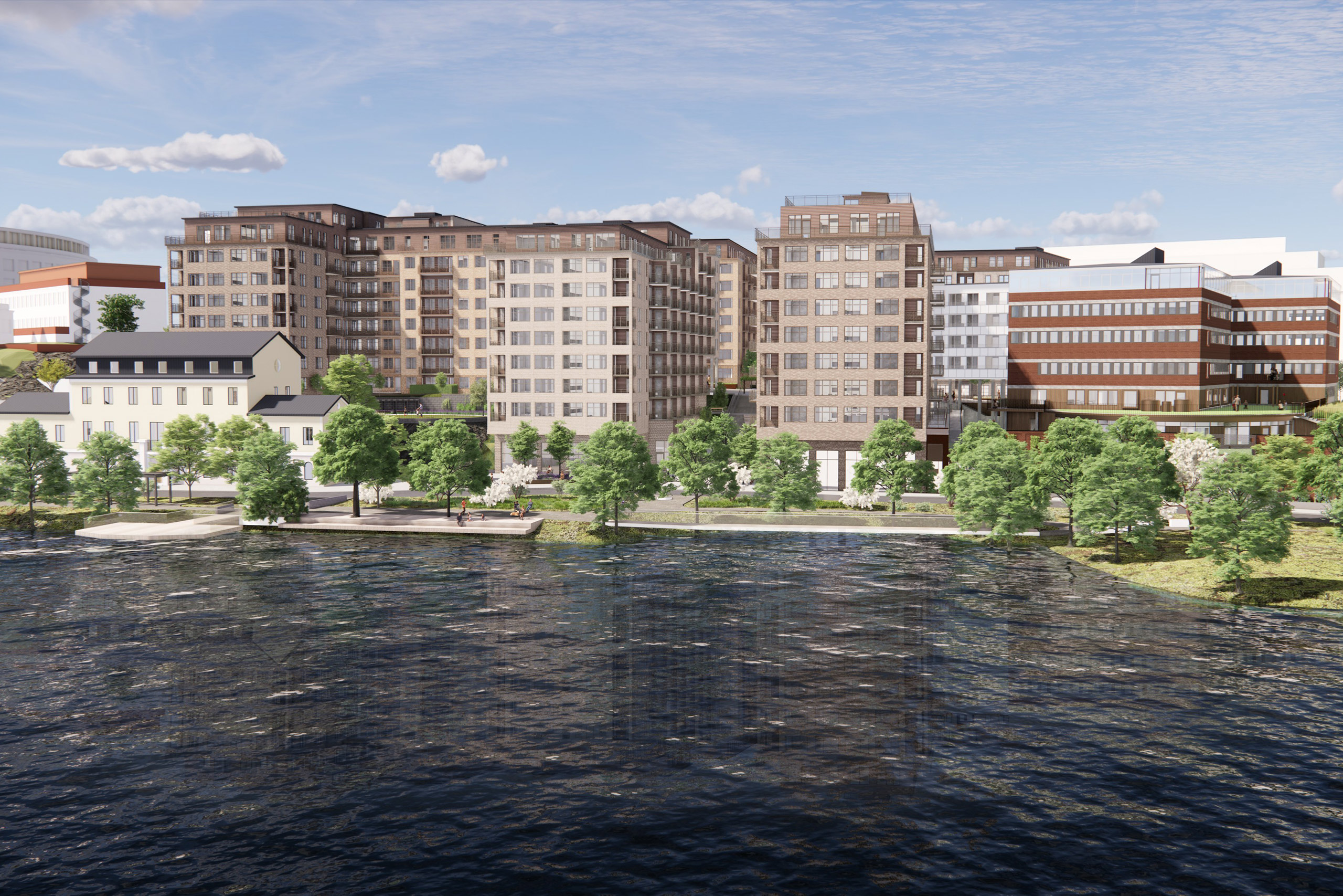 Flera bostadshus vid vatten och kajpromenad.